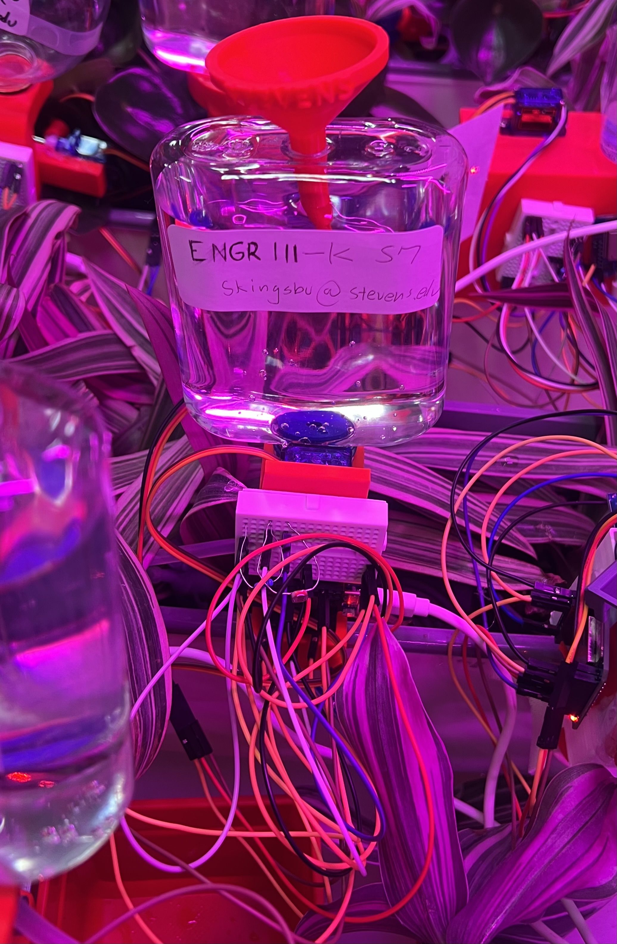 Final smart watering system mounted on plant pot